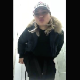 A pretty blonde girl blows a kiss to the camera, pulls down her pants, farts, and takes a shit into a toilet while bending over in front of it. Vertical format video. About a minute.